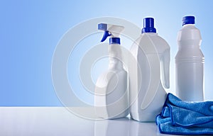 Cleaning products on white table overview