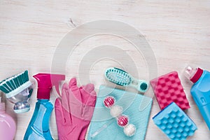 Cleaning products on wooden background with copyspace at the top