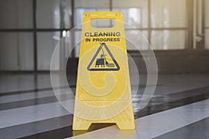 Cleaning progress caution sign in office background