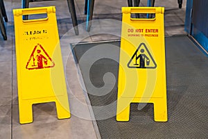 Cleaning in progress caution sign in pathways in the restaurant