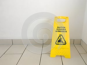 Cleaning in progress caution yellow sign on office floor