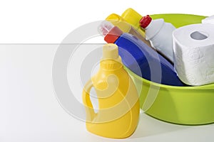 Cleaning and repair products, household chemicals, rubber gloves, green basin for cleaning the apartment and office