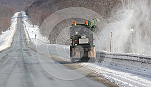 Cleaning the road from snow.