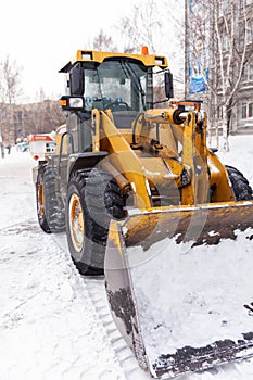 Cleaning and cleaning of roads in the city from snow in winter