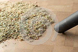 cleaning sawdust from the wooden surface with a vacuum cleaner