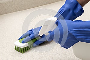 Cleaning And Scrubbing With Rubber Gloves photo