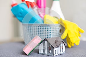 Cleaning service. Bucket with sponges, chemicals bottles and mopping stick. Rubber gloves and towel. Household equipment