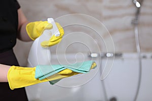 Cleaning service in an expensive hotel or at home. A woman in a uniform and rubber gloves.Cleanliness and hygiene in the