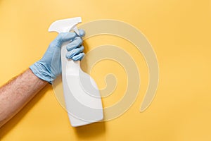 Cleaning Service Worker. Male hand with bottle of disinfectant