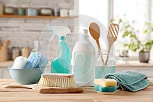 Cleaning set with products and tools on kitchen table