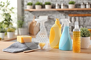 Cleaning set with products and tools on kitchen table
