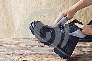 Cleaning shoes on wooden background