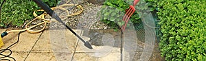 Cleaning the slabs of an outdoor terrace of a house with a karcher