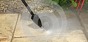 Cleaning the slabs of an outdoor terrace of a house with a karcher