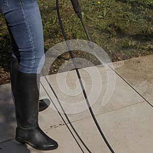 Cleaning the slabs of an outdoor terrace of a house with a karcher