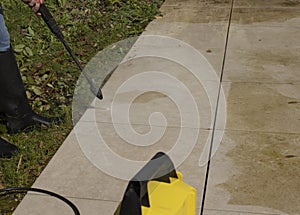 Cleaning the slabs of an outdoor terrace of a house with a karcher