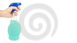 Cleaning spray bottle in hand isolated on white background. Housework and sanitary concept. copy space, template