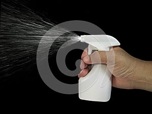 Cleaning spray bottle in hand isolated on white background. Housework and sanitary concept. copy space, template.