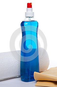 Cleaning spray with a roll of paper towels and a shammy