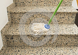 Cleaning the stairs marble with mop