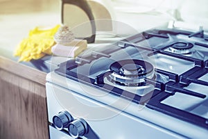 Cleaning the stove after cooking. Gas burner without burning gas. Safe use of gas equipment. Selective focus. Close up