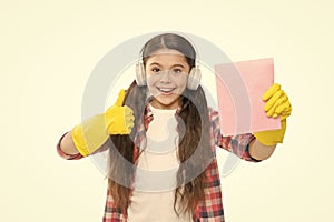Cleaning supplies. Anti allergen cleaning products. Let music move you. Girl headphones and gloves cleaning. Make