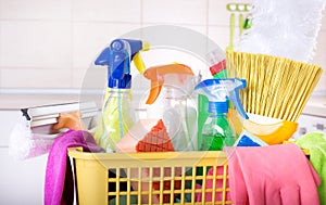 Cleaning supplies in basket in kitchen