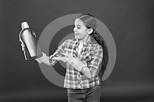 Cleaning supplies. Disinfecting gels suitable for all family. Girl in rubber gloves for cleaning hold plastic bottle