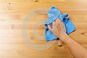 Cleaning table by blue rag