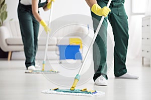 Cleaning team wiping the floor