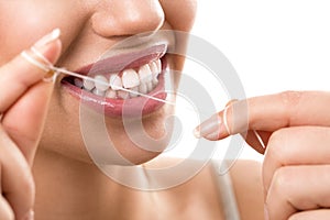 Cleaning teeth with dental floss