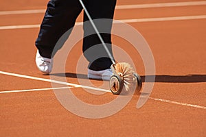 Cleaning tennis court