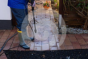 Cleaning terrace with a power washer