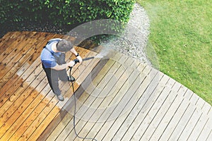 Cleaning terrace with a power washer - high water pressure clean
