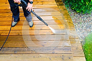 Cleaning terrace with a power washer - high water pressure clean