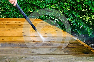 cleaning terrace with a power washer - high water pressure clean