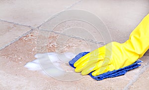 Cleaning tile with cloth photo