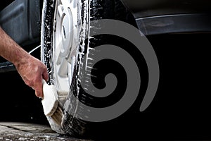 Cleaning tire in a car wash