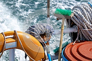 Cleaning tool including mob and brush with handle, Safety buoy and old white rope