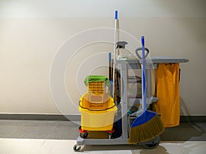 Cleaning tools cart wait for cleaner. Bucket and set of cleaning equipment in the Department store. janitor service janitorial for photo