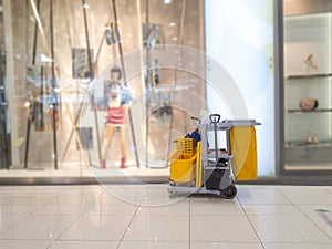 Cleaning tools cart wait for cleaner.Bucket and set of cleaning equipment in the Department store. janitor service janitorial for