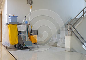 Cleaning tools cart wait for cleaner.Bucket and set of cleaning equipment in the apartment. janitor service janitorial for your pl photo