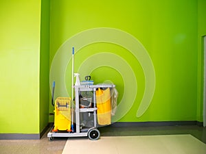 Cleaning tools cart wait for cleaning.Bucket and set of cleaning equipment in the office