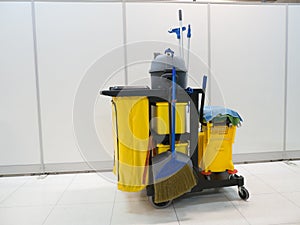 Cleaning tools cart wait for cleaning.Bucket and set of cleaning equipment in the office. janitor service janitorial for your