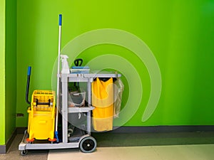 Cleaning tools cart wait for cleaning.Bucket and set of cleaning equipment in the office. janitor service janitorial for your plac
