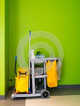 Cleaning tools cart wait for cleaning.Bucket and set of cleaning equipment in the office. janitor service janitorial for your plac