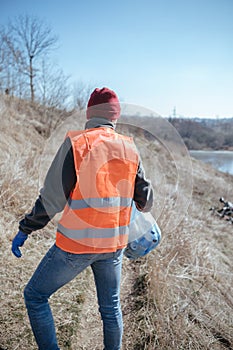 Cleaning trash in the forest, ecoactivist
