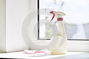 cleaning or washing dirty domestic window with a chemical spray. housework cleanup concept