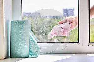 cleaning or washing dirty domestic window with a chemical spray. housework cleanup concept