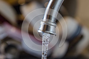 Cleaning water flowing from pipe tap